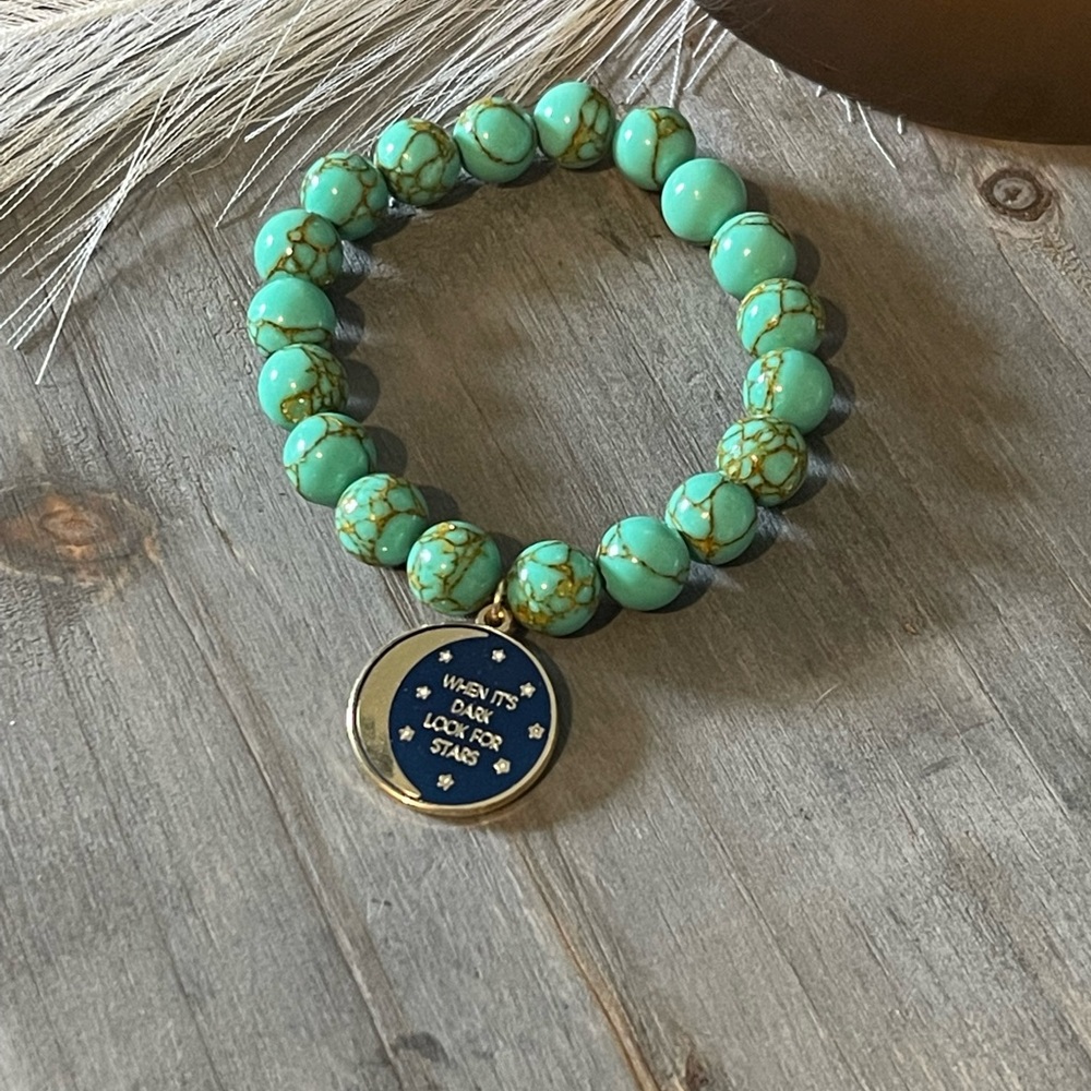 Turquoise lace bracelet with charm